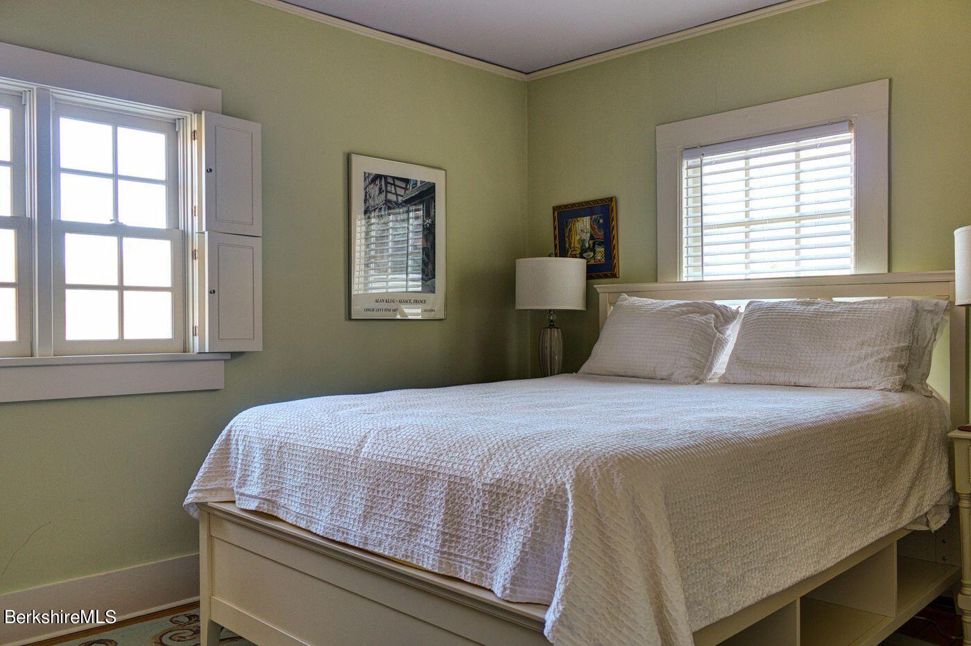 331 Rossiter Road Richmond, MA 01254 - Photo 18 of 28 a bedroom with a bed and wooden floor