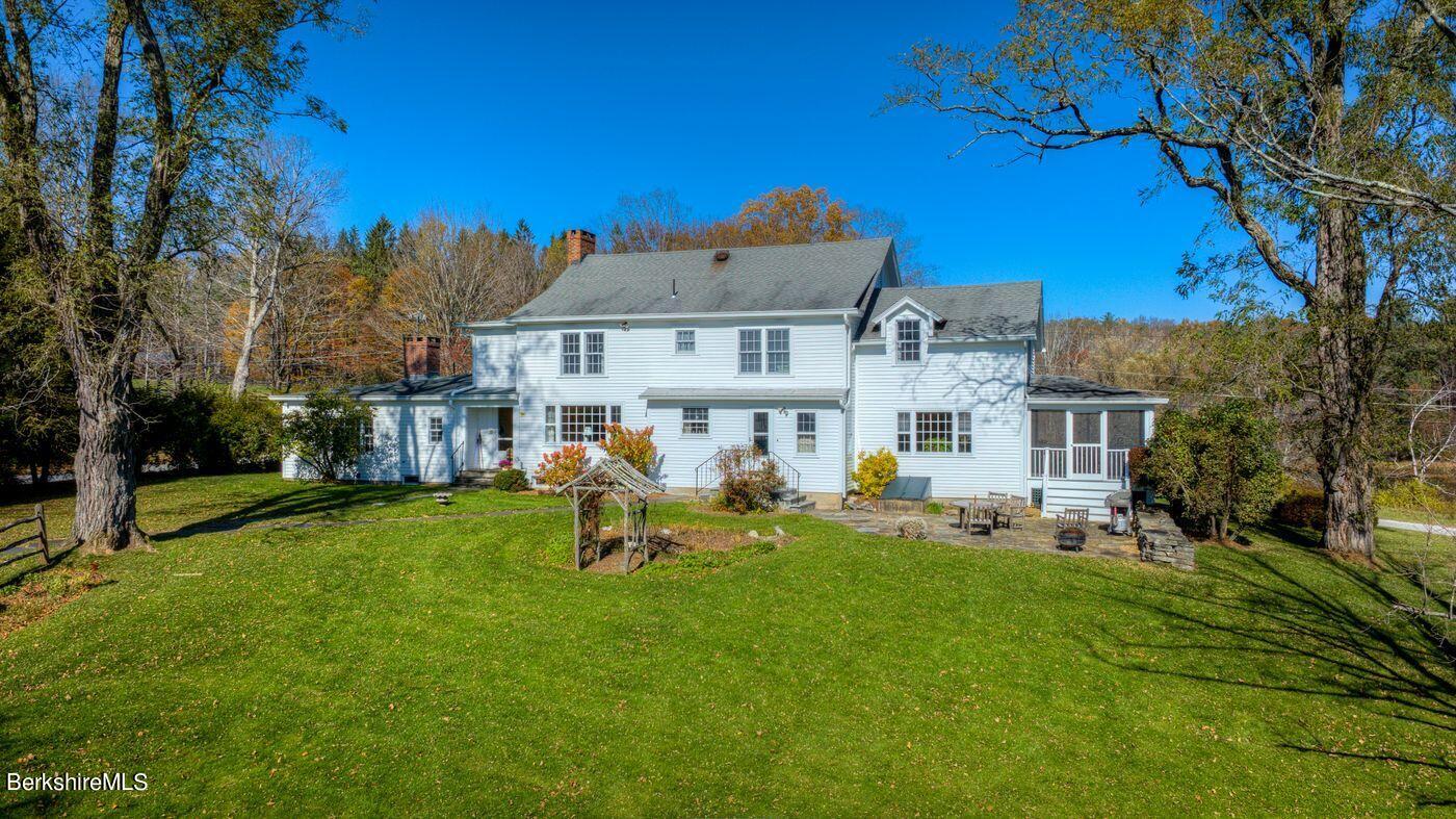 331 Rossiter Road Richmond, MA 01254 - Photo 23 of 28 a view of a building with a yard