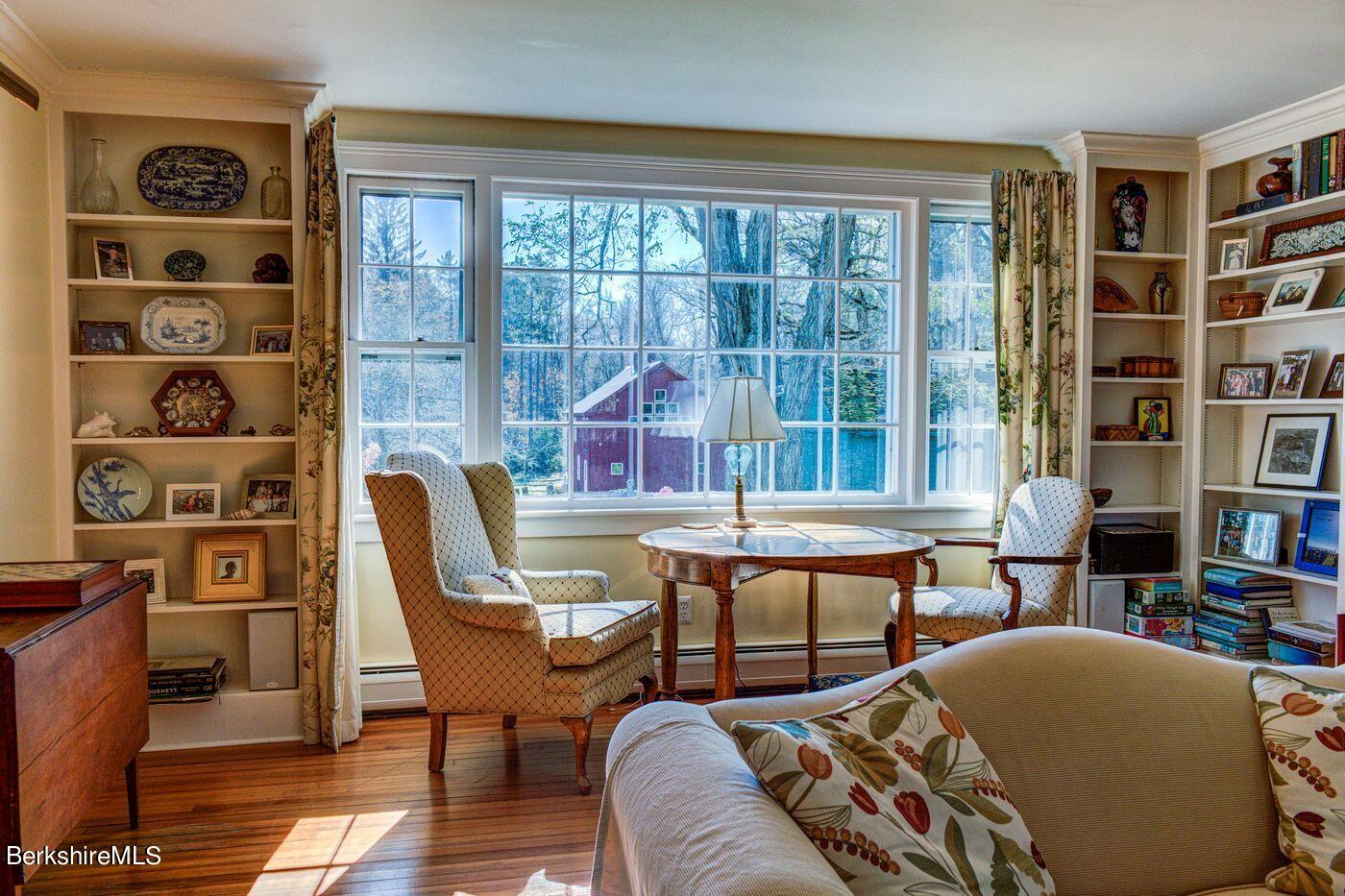 331 Rossiter Road Richmond, MA 01254 - Photo 6 of 28 a living room with furniture a bookshelf and a window
