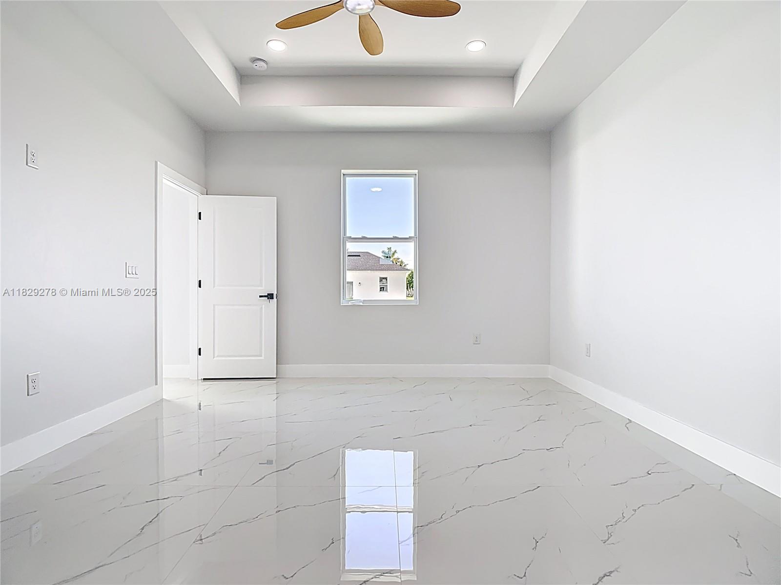 5002 Bygone Street Lehigh Acres, FL 33971 - Photo 32 of 51 an empty room with windows and closet