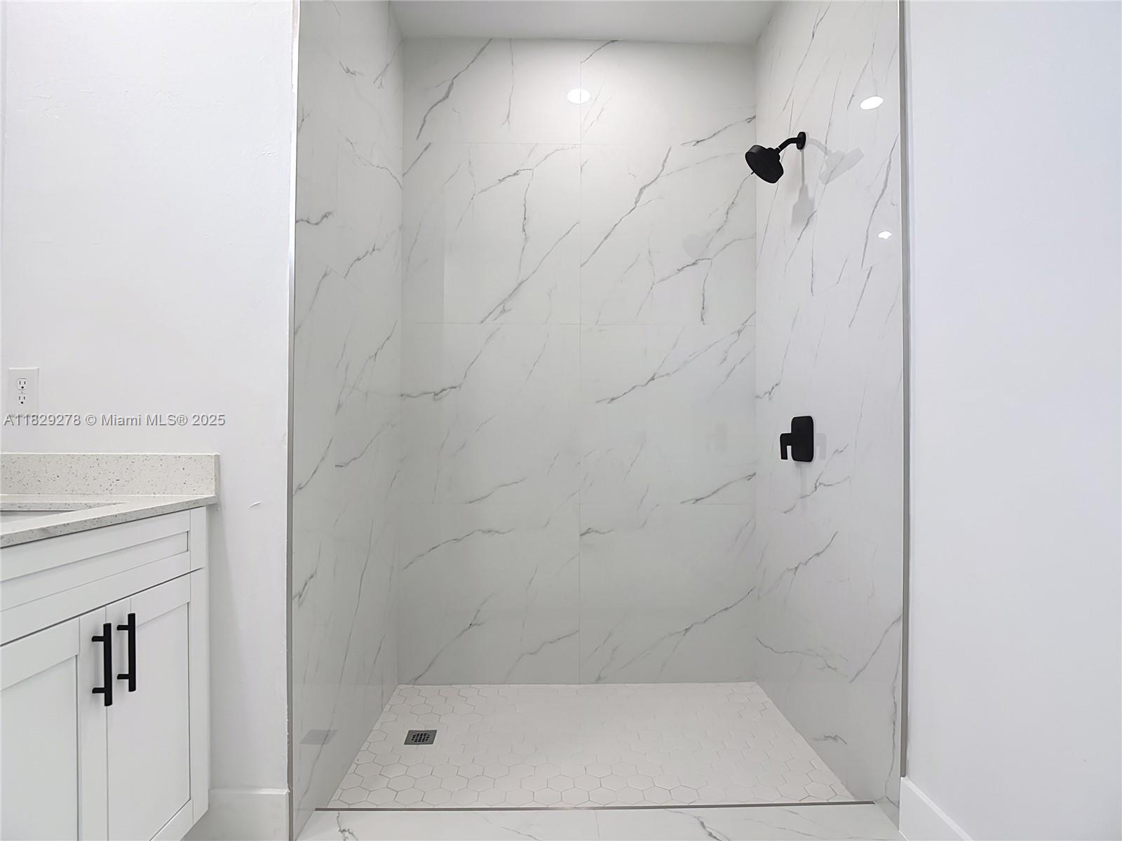 5002 Bygone Street Lehigh Acres, FL 33971 - Photo 38 of 51 a bathroom with a shower