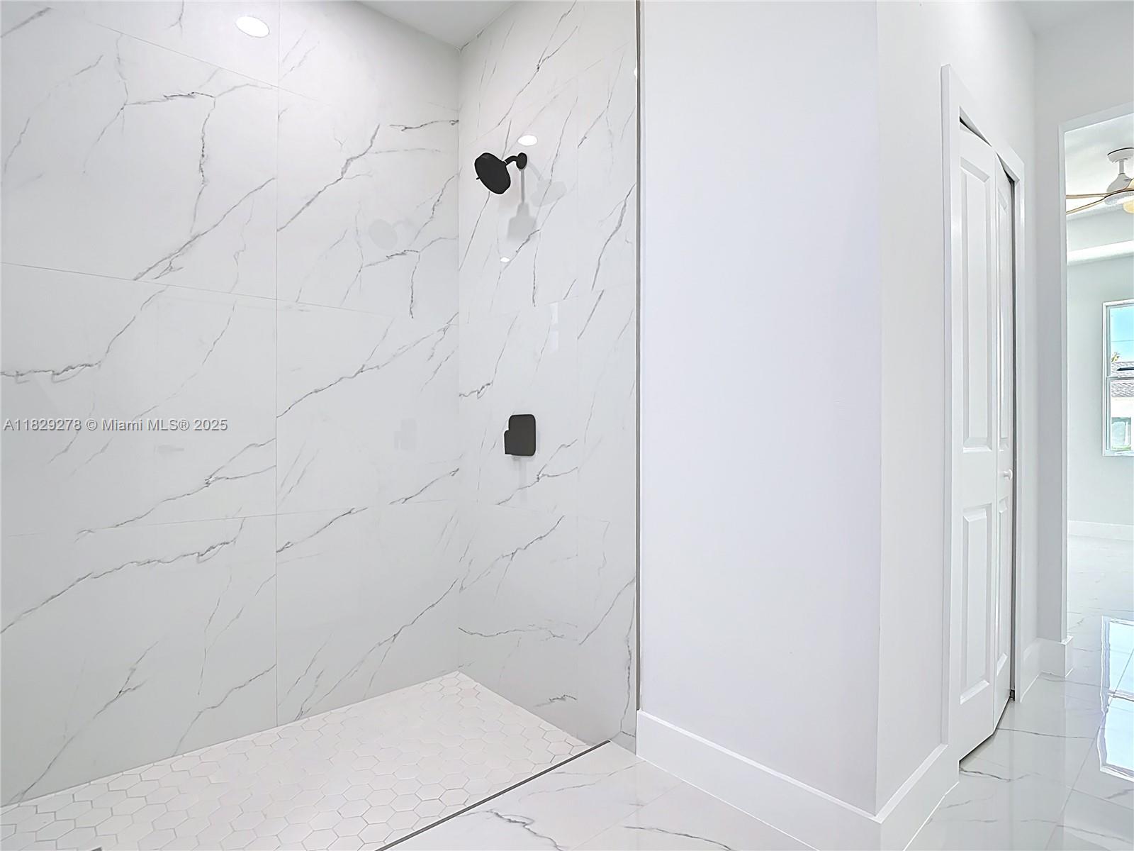 5002 Bygone Street Lehigh Acres, FL 33971 - Photo 39 of 51 a bathroom with a shower