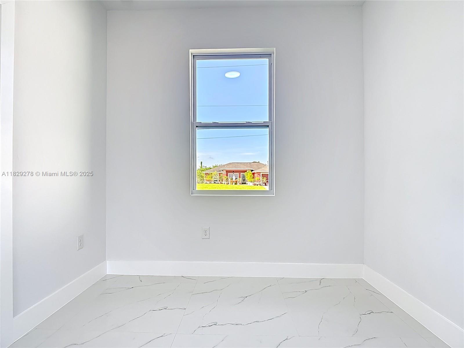 5002 Bygone Street Lehigh Acres, FL 33971 - Photo 42 of 51 a view of an empty room