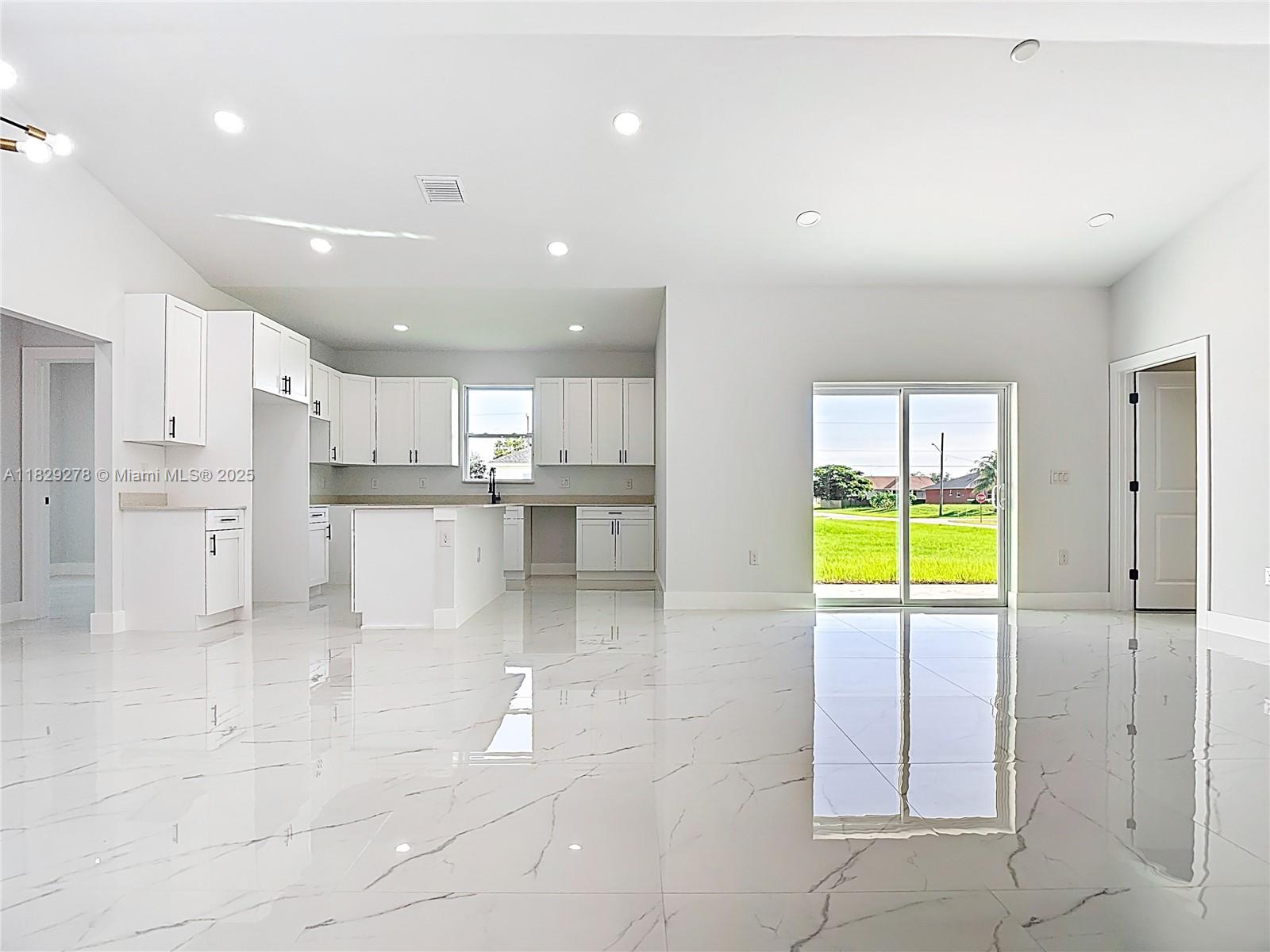 5002 Bygone Street Lehigh Acres, FL 33971 - Photo 10 of 51 a view of kitchen with stainless steel appliances refrigerator oven and cabinets