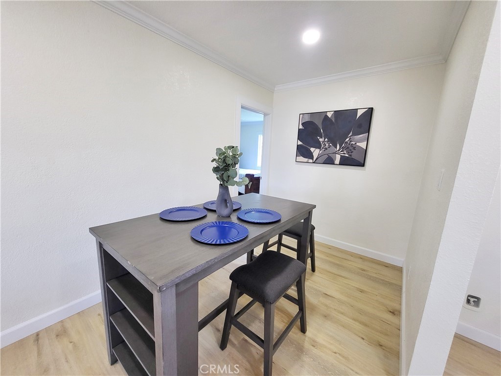 13927 Brightwell Avenue Paramount, CA 90723 - Photo 16 of 36 a view of a dining room with furniture