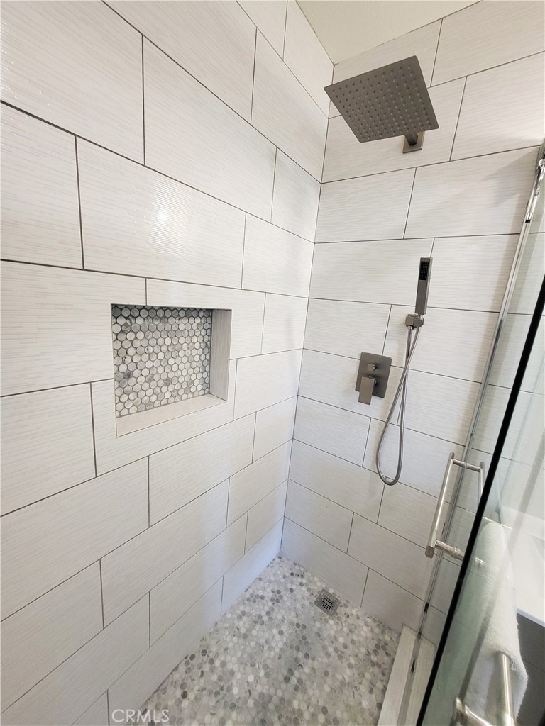 13927 Brightwell Avenue Paramount, CA 90723 - Photo 19 of 36 a bathroom with a shower