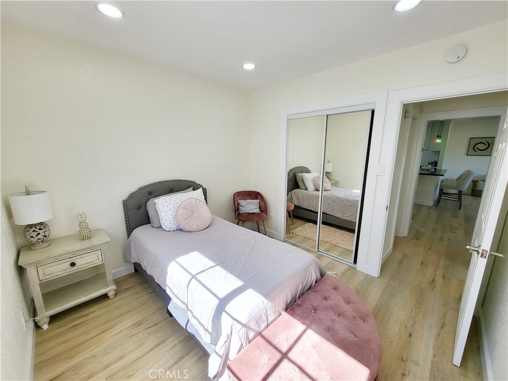 13927 Brightwell Avenue Paramount, CA 90723 - Photo 21 of 36 a bedroom with a bed and a mirror