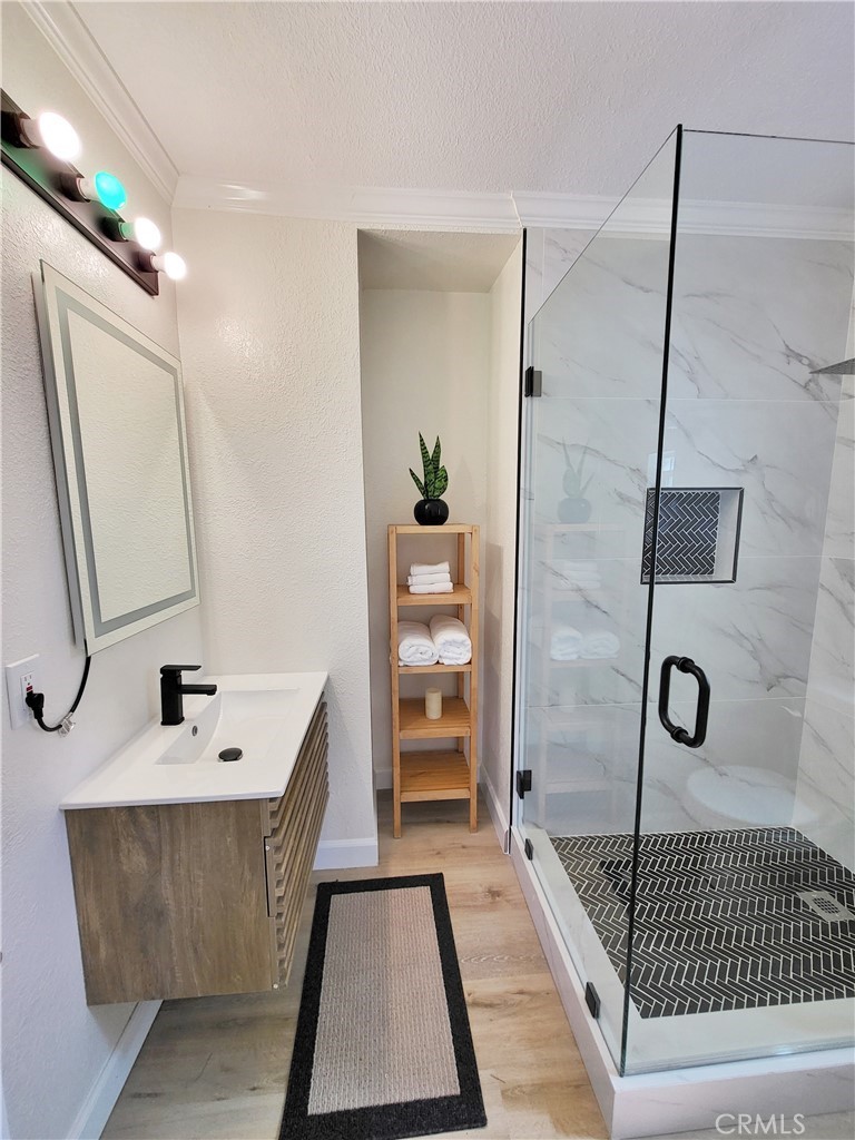 13927 Brightwell Avenue Paramount, CA 90723 - Photo 30 of 36 a bathroom with a sink a toilet and shower