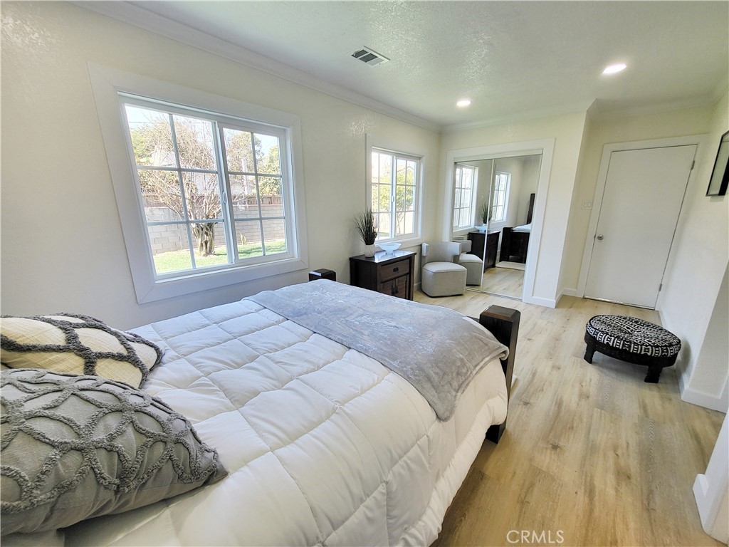 13927 Brightwell Avenue Paramount, CA 90723 - Photo 32 of 36 a bedroom with bed and a window