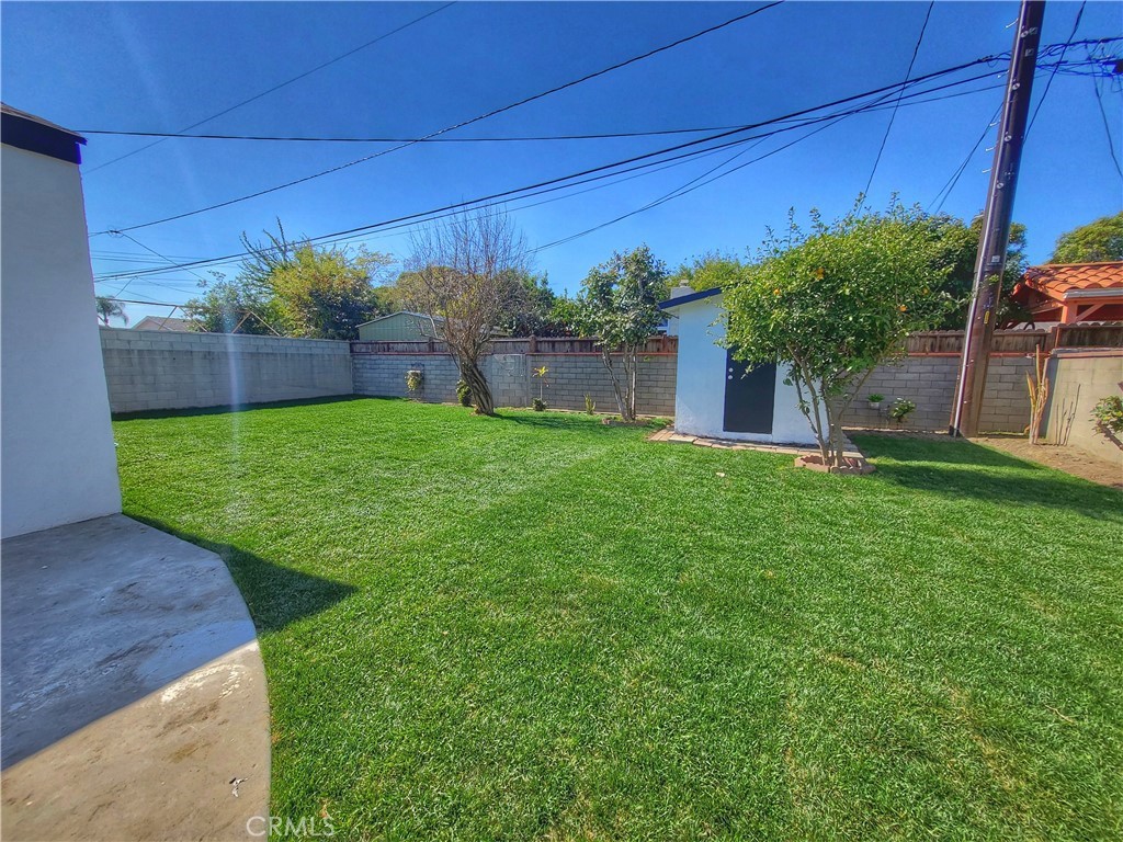 13927 Brightwell Avenue Paramount, CA 90723 - Photo 33 of 36 a view of a backyard with potted plants