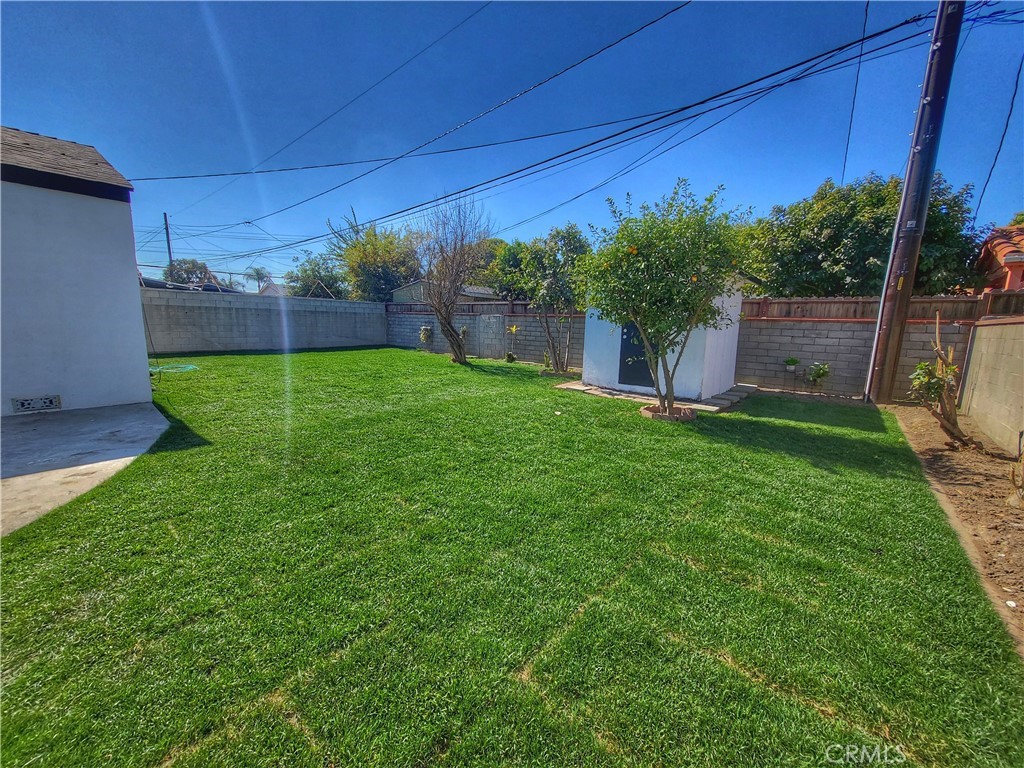 13927 Brightwell Avenue Paramount, CA 90723 - Photo 34 of 36 a view of a backyard with a garden