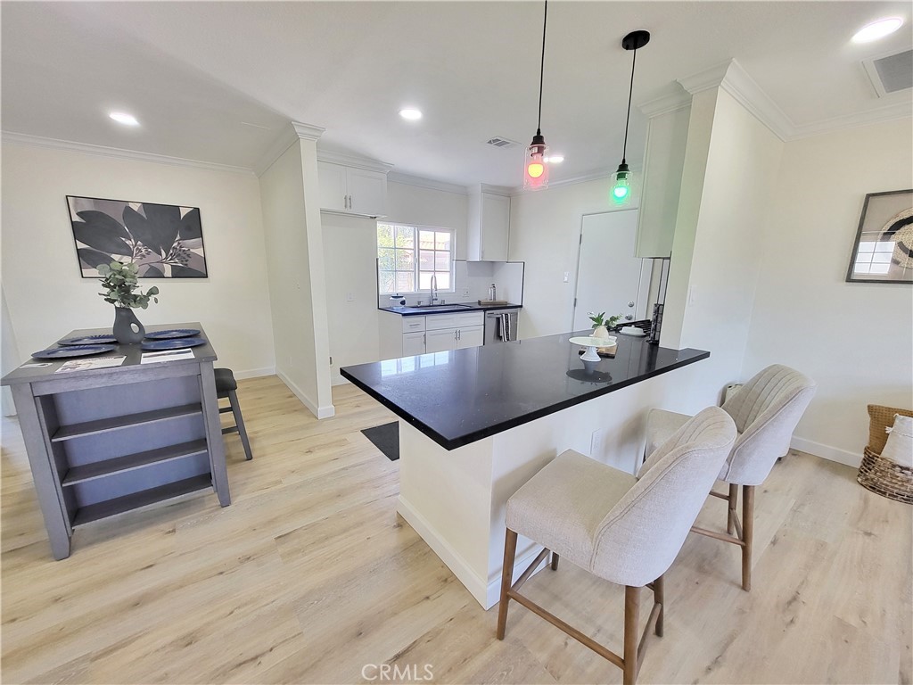 13927 Brightwell Avenue Paramount, CA 90723 - Photo 10 of 36 a view of kitchen and dining area with furniture