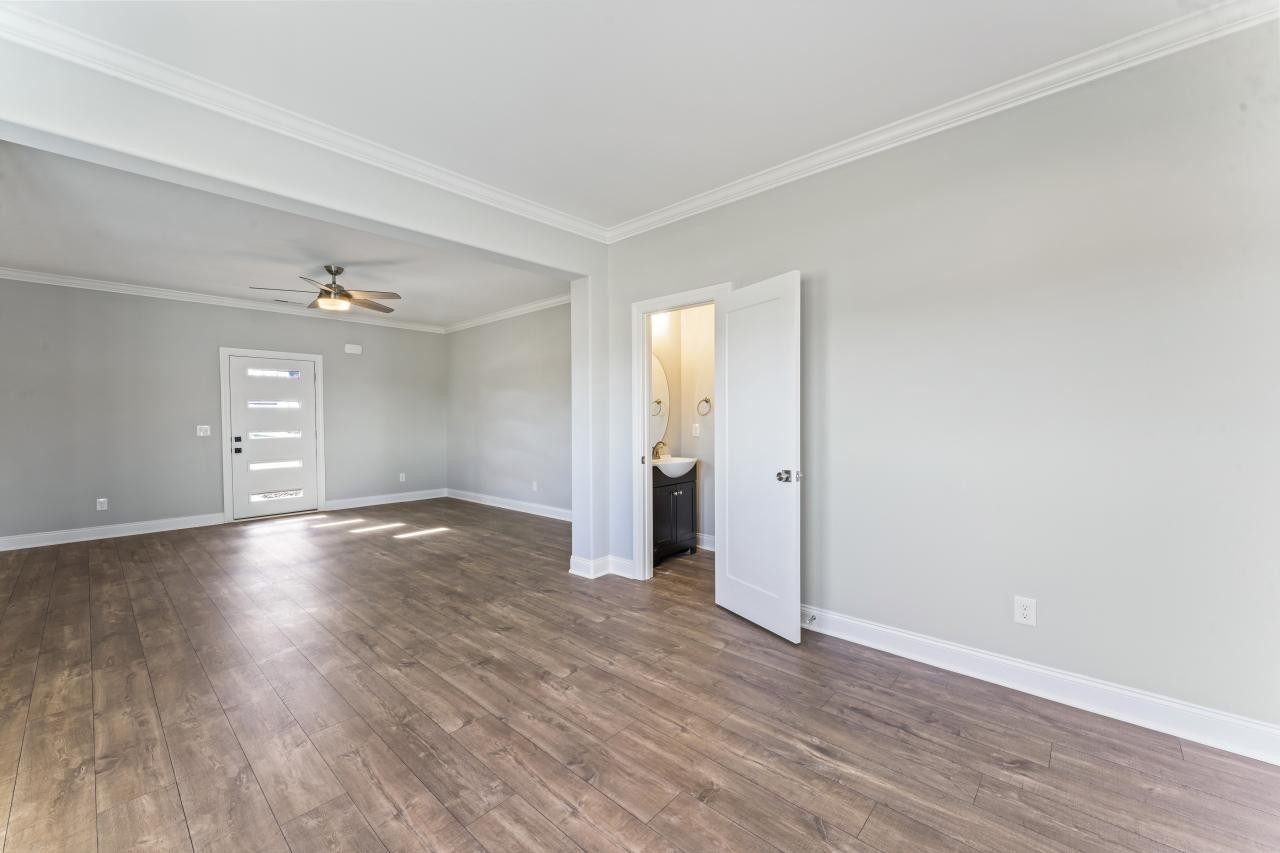 2132 Gracie Bug Loop Murfreesboro, TN 37128 - Photo 11 of 24 an empty room with wooden floor and windows