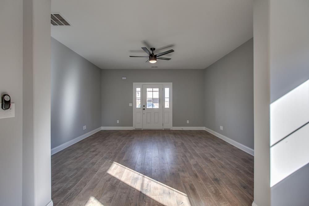 2132 Gracie Bug Loop Murfreesboro, TN 37128 - Photo 15 of 21 an empty room with wooden floor and ceiling fan