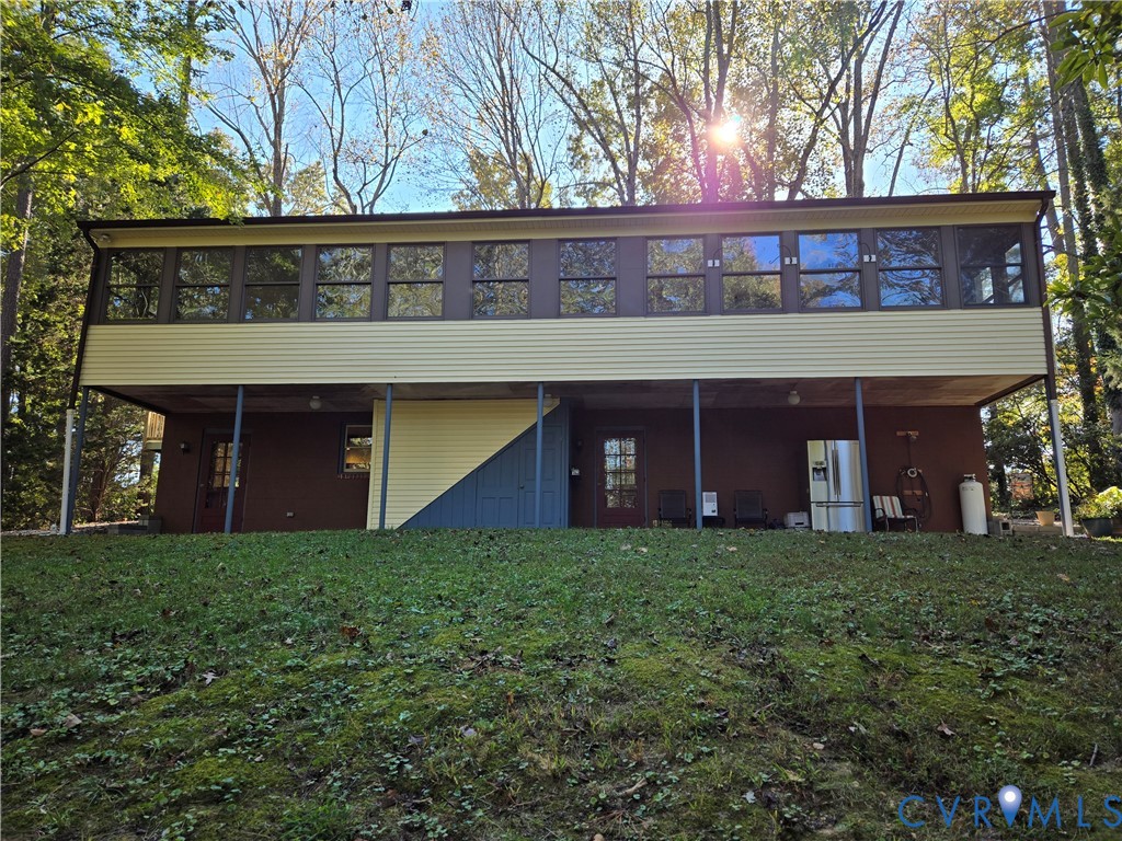 2198 Old Church Road Mechanicsville, VA 23111 - Photo 17 of 50 Rear view of house with a sunroom and a lawn