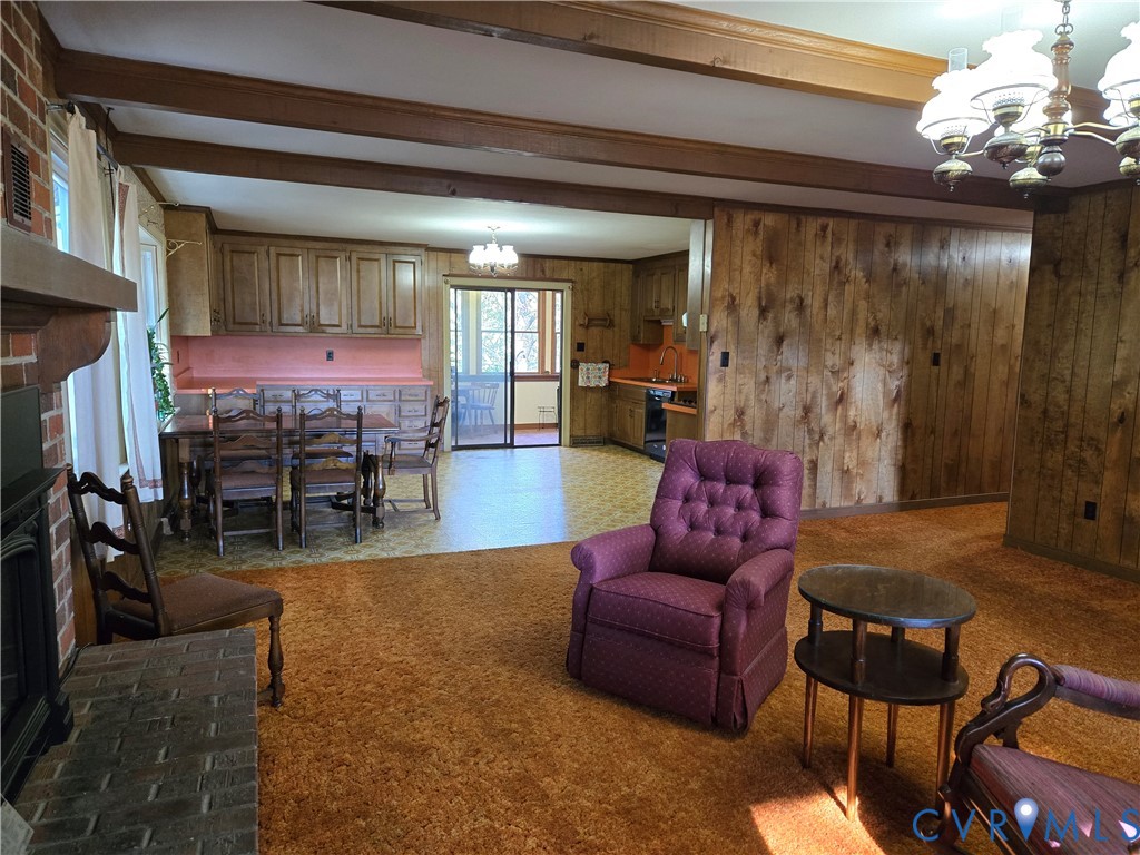 2198 Old Church Road Mechanicsville, VA 23111 - Photo 26 of 50 Living room with a fireplace, wood walls, light co