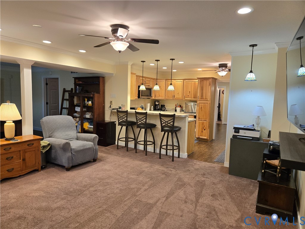 2198 Old Church Road Mechanicsville, VA 23111 - Photo 46 of 50 Basement Living room featuring a ceiling fan, orna