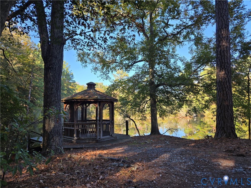 2198 Old Church Road Mechanicsville, VA 23111 - Photo 7 of 50 View of yard with a gazebo, a wooden deck, and vie