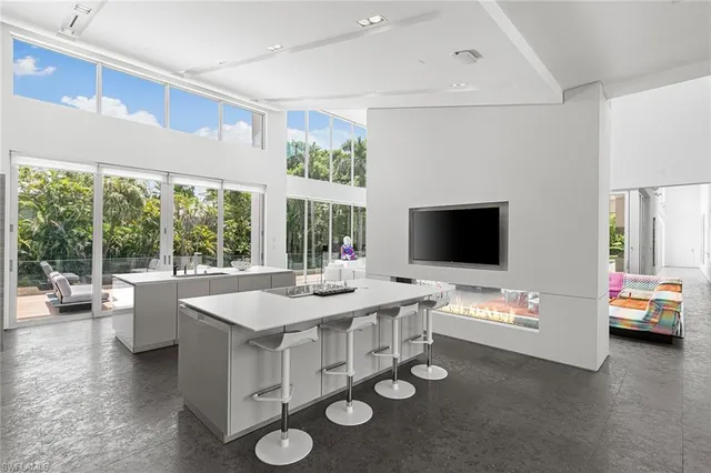 a kitchen with a stove and a white kitchen island