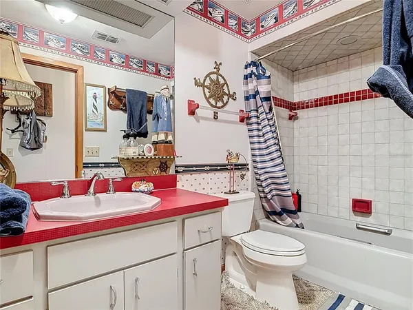 a kitchen with a sink and a refrigerator