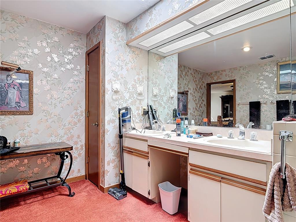 24545 Snail Road Astor, FL 32102 - Photo 25 of 61 a kitchen with a sink and a refrigerator