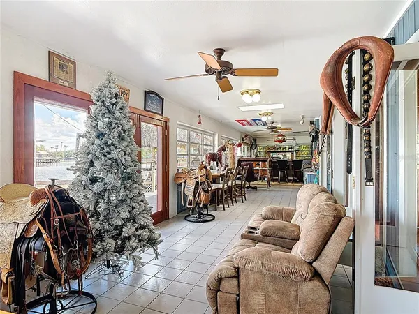 a view of a patio with a table chairs and a backyard