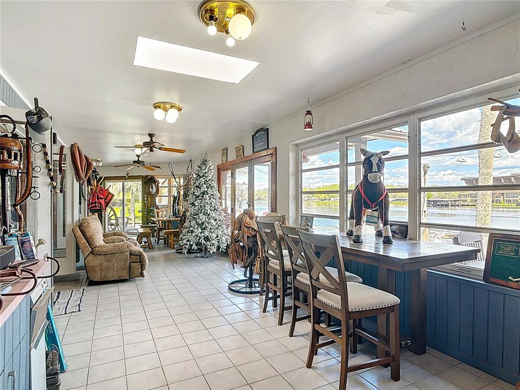 24545 Snail Road Astor, FL 32102 - Photo 28 of 61 a view of a dining room with furniture window and outside view