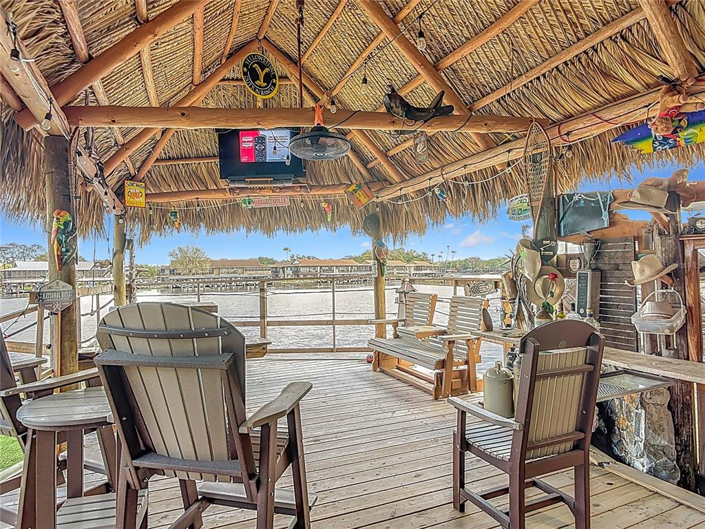 24545 Snail Road Astor, FL 32102 - Photo 3 of 61 a view of a chairs and table in the patio