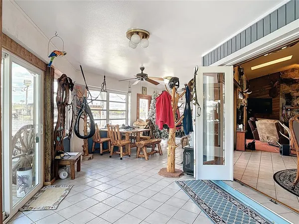 a view of a terrace with lawn chairs