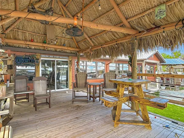 a view of a patio with a table and chairs