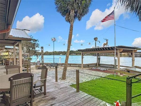 a view of a swimming pool with a table and chairs