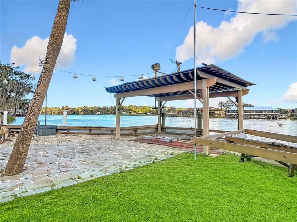 24545 Snail Road Astor, FL 32102 - Photo 36 of 61 a view of a house with a yard