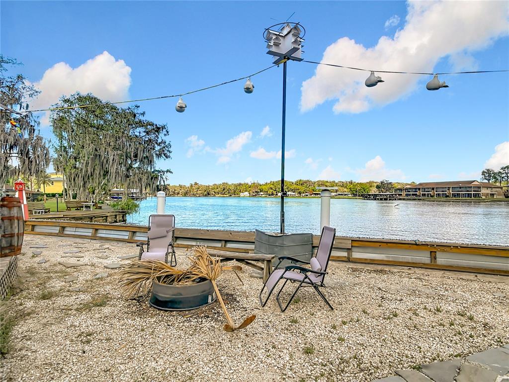 24545 Snail Road Astor, FL 32102 - Photo 38 of 61 a view of a terrace with lawn chairs