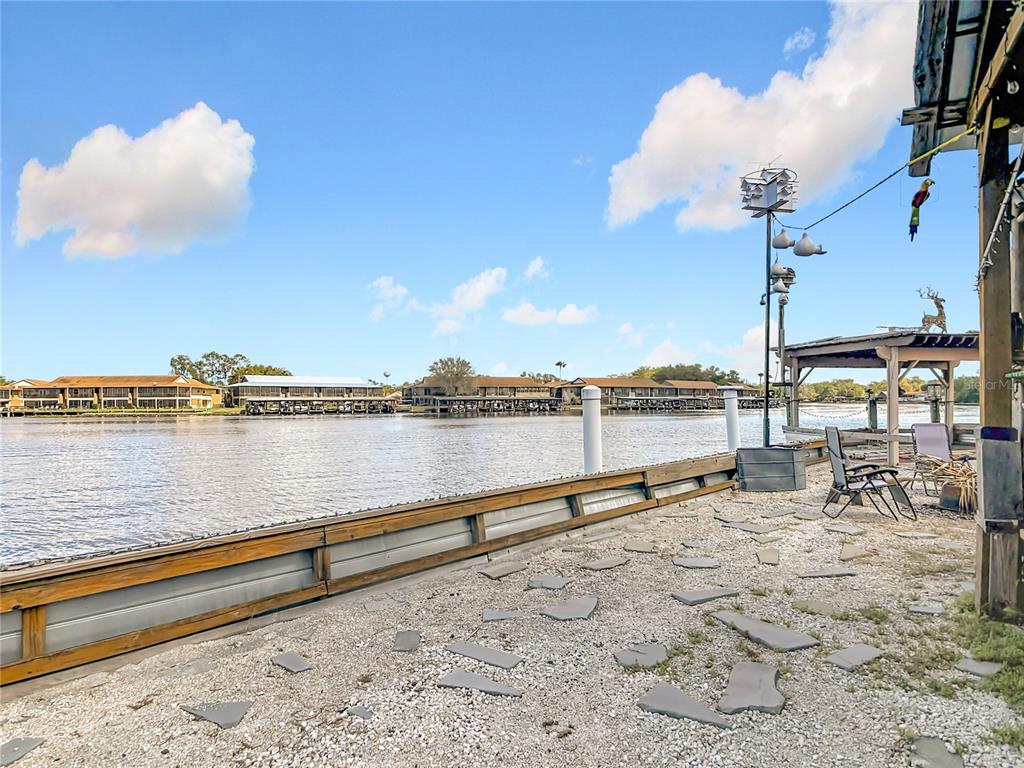 24545 Snail Road Astor, FL 32102 - Photo 40 of 61 a view of a terrace with a lake view