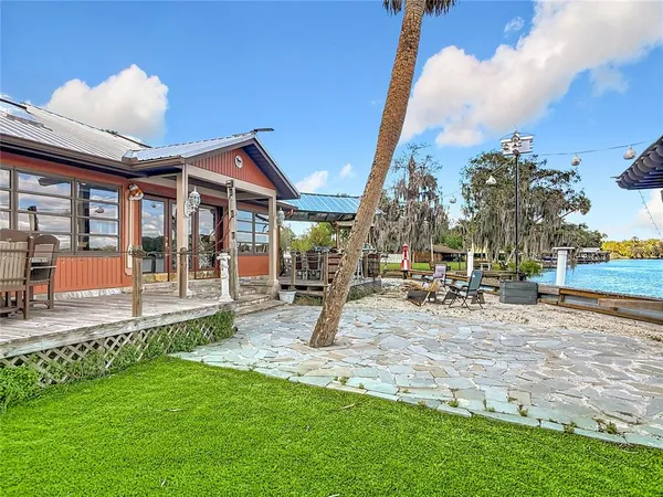 a view of a swimming pool with outdoor seating