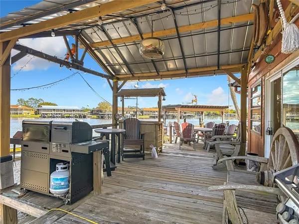 a front view of a house with swimming pool having outdoor seating