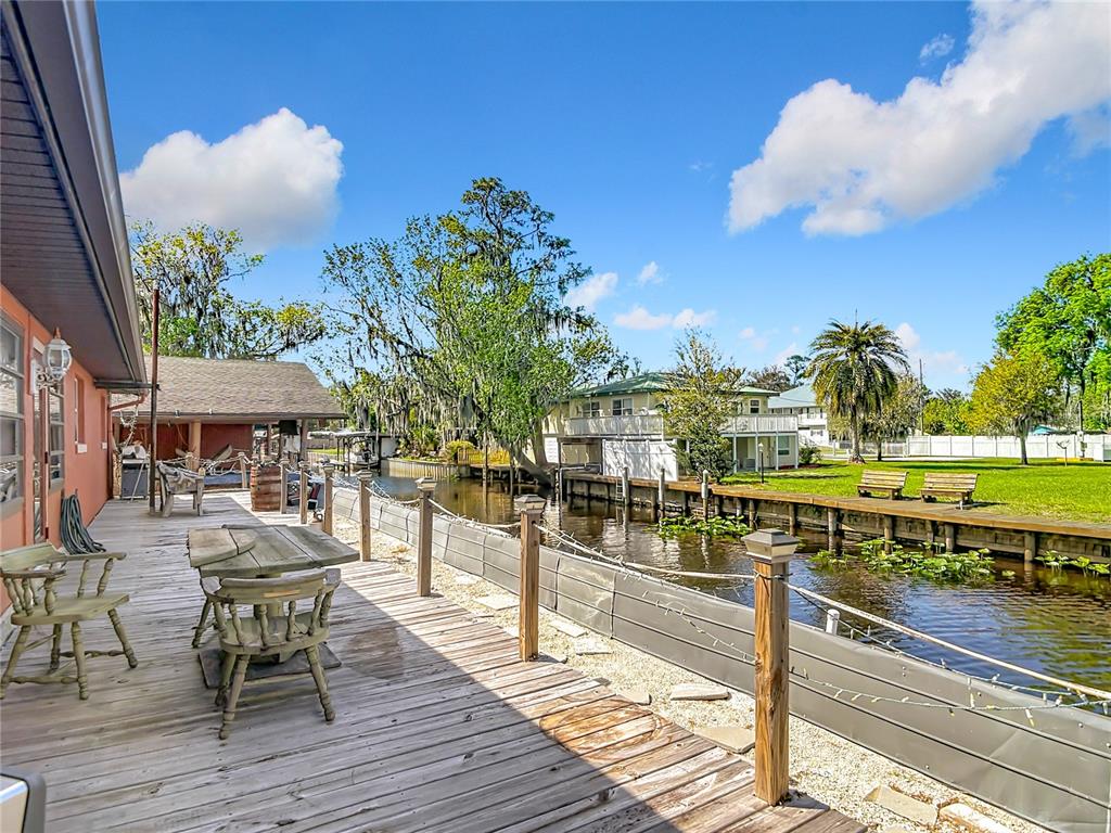 24545 Snail Road Astor, FL 32102 - Photo 44 of 61 a view of a swimming pool with a patio