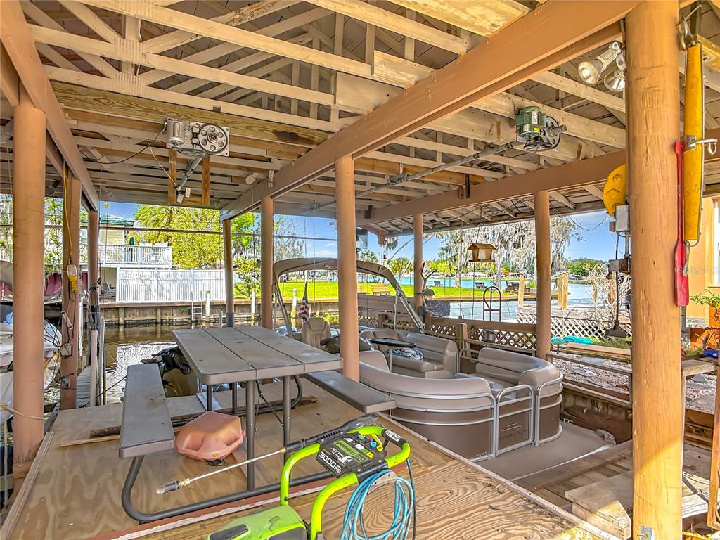 24545 Snail Road Astor, FL 32102 - Photo 50 of 61 a view of a swimming pool with outdoor seating