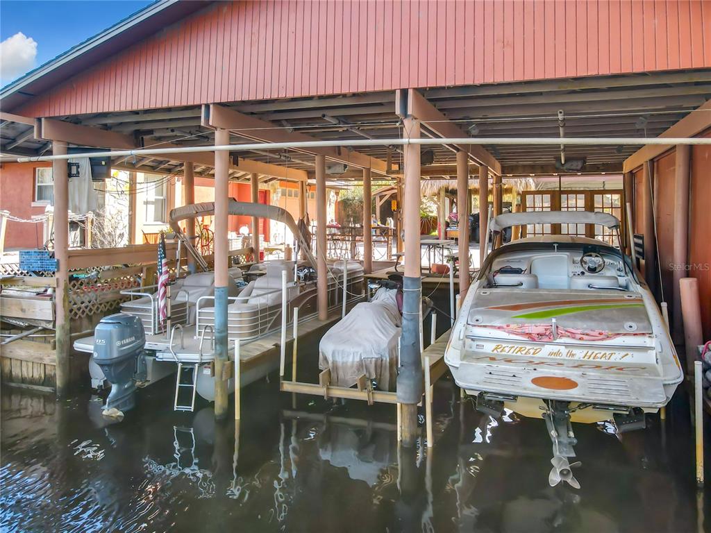 24545 Snail Road Astor, FL 32102 - Photo 53 of 61 a room with lots of tables and chairs