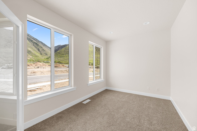 1510 West 600 North, Unit GE 04 Mapleton, UT 84664 - Photo 5 of 21 Room with light neutral wall paint, white trim, and brown carpet