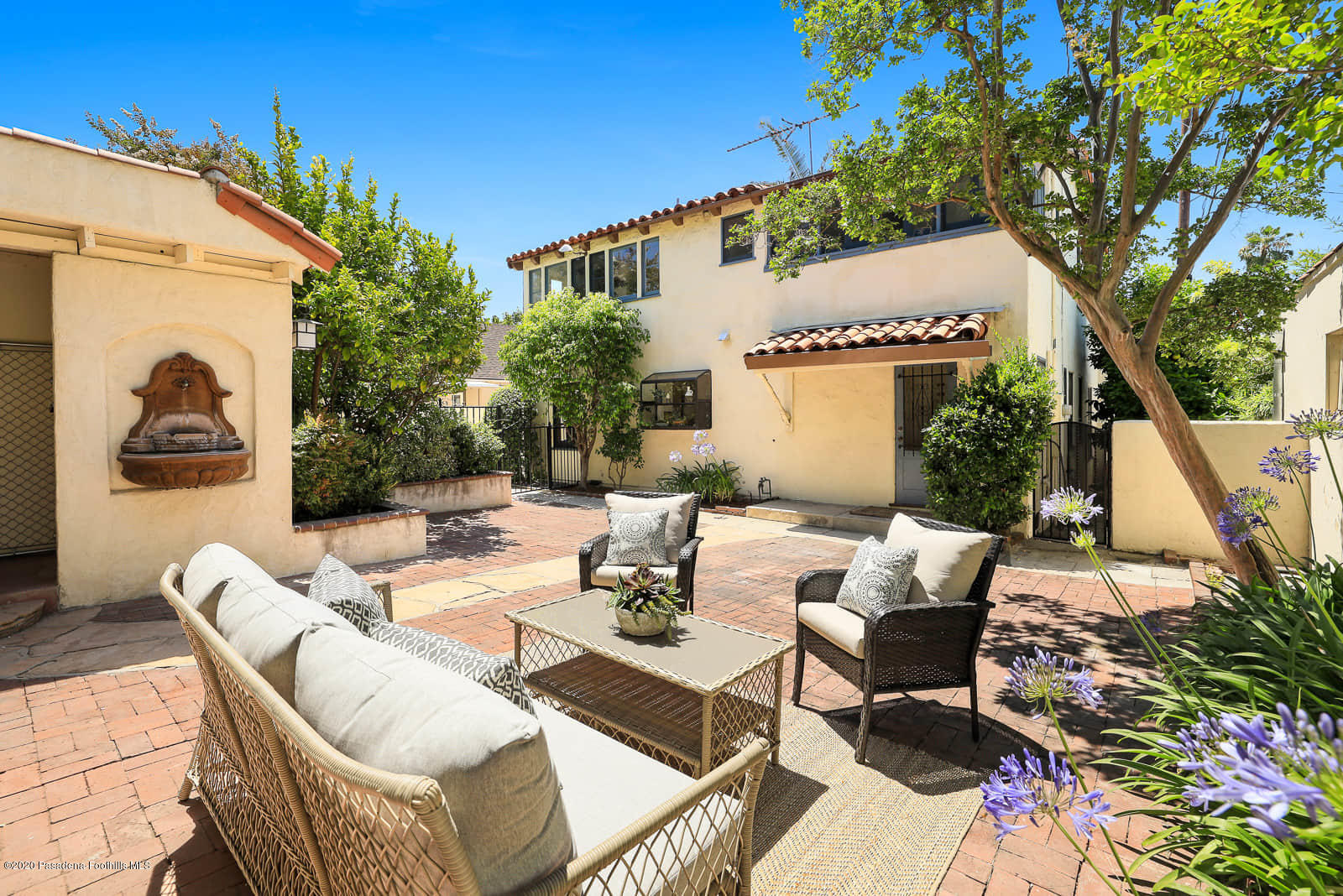 943 Cabrillo Drive Glendale, CA 91207 - Photo 13 of 13 a view of a patio with couches table and chairs and potted plants