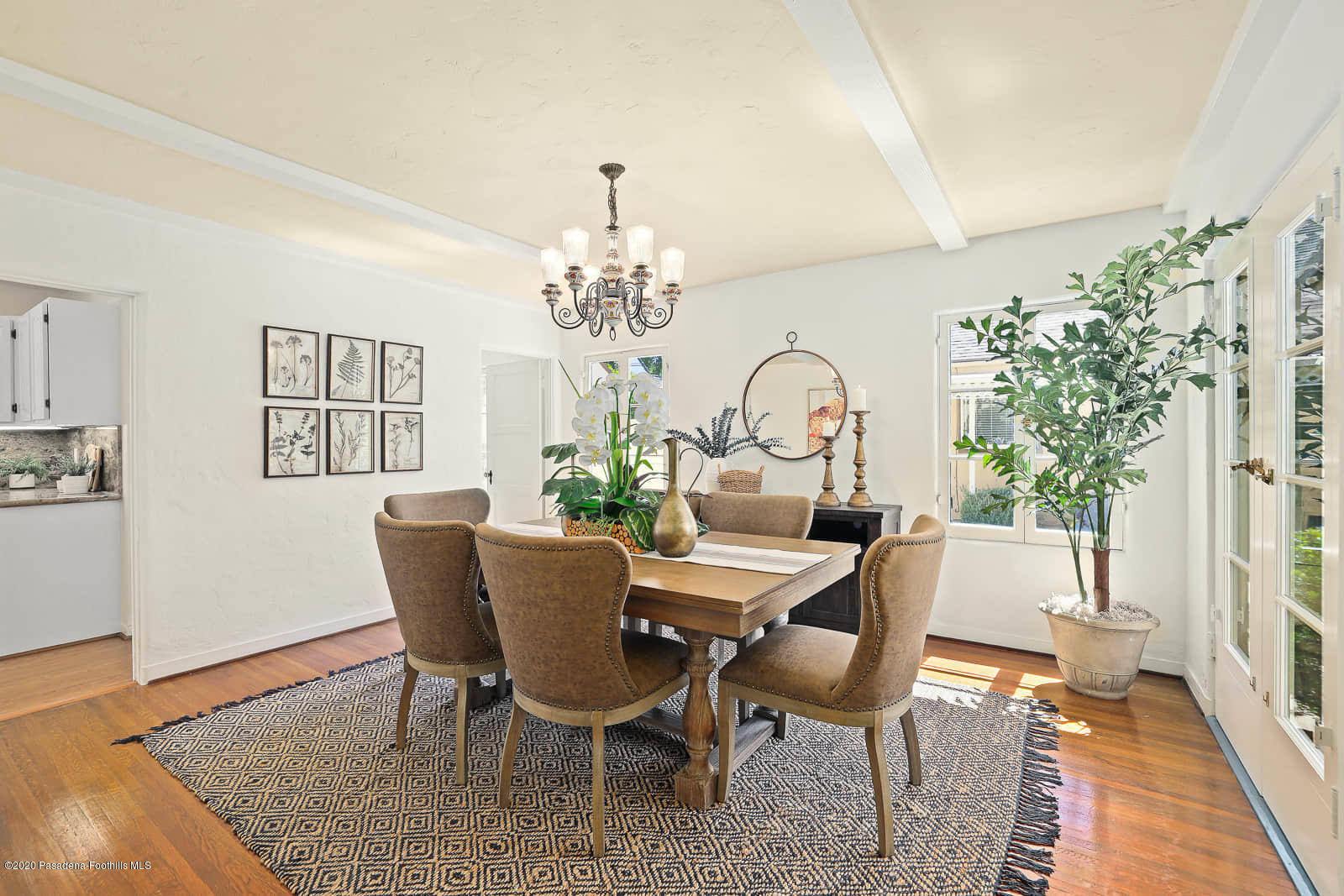 943 Cabrillo Drive Glendale, CA 91207 - Photo 7 of 13 a view of a dining room with furniture a chandelier and wooden floor