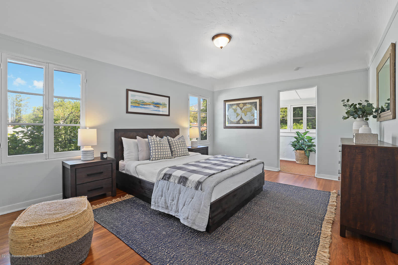 943 Cabrillo Drive Glendale, CA 91207 - Photo 10 of 13 a spacious bedroom with a bed and a couch