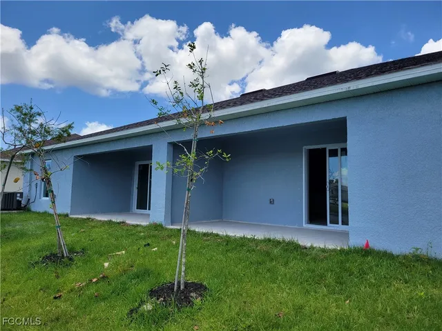a backyard of a house with lots of green space