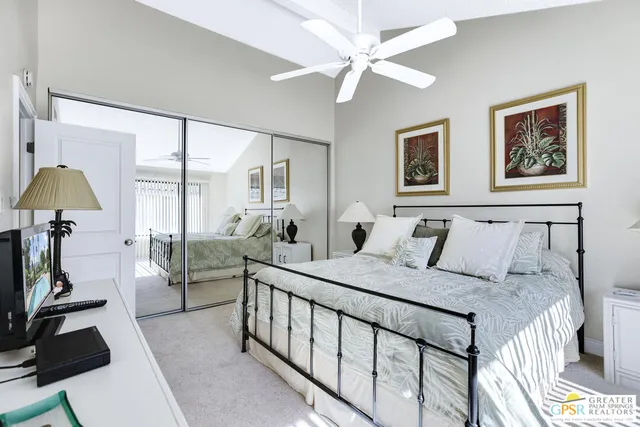 a bed room with a bed and a chandelier