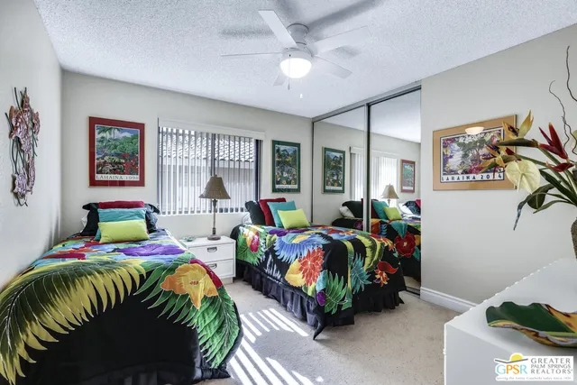 a bedroom with bed and a window