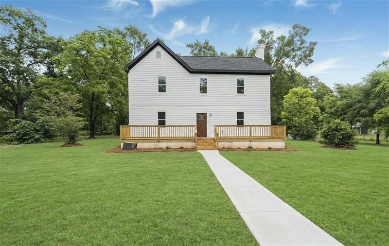 331 Highway 162 Covington, GA 30016 - Photo 1 of 26 a view of a backyard with plants and a garden