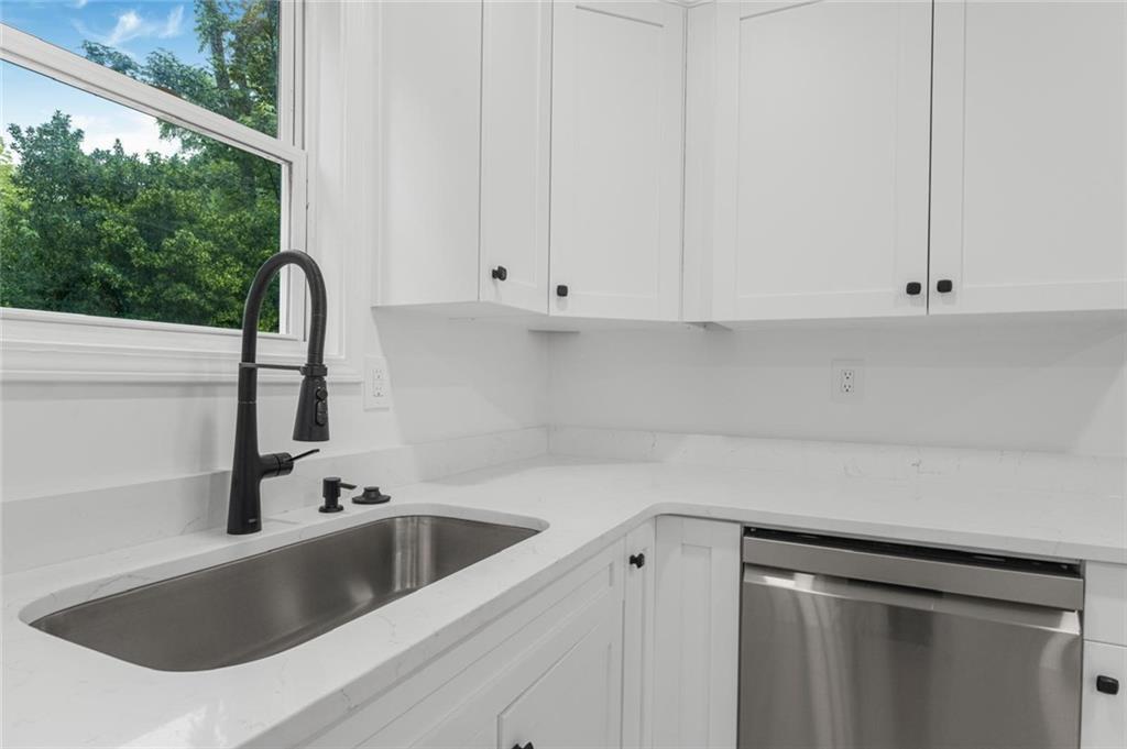 331 Highway 162 Covington, GA 30016 - Photo 13 of 26 a kitchen with a sink and cabinets
