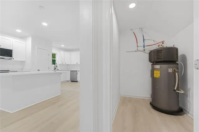 a view of a kitchen with fridge and a sink