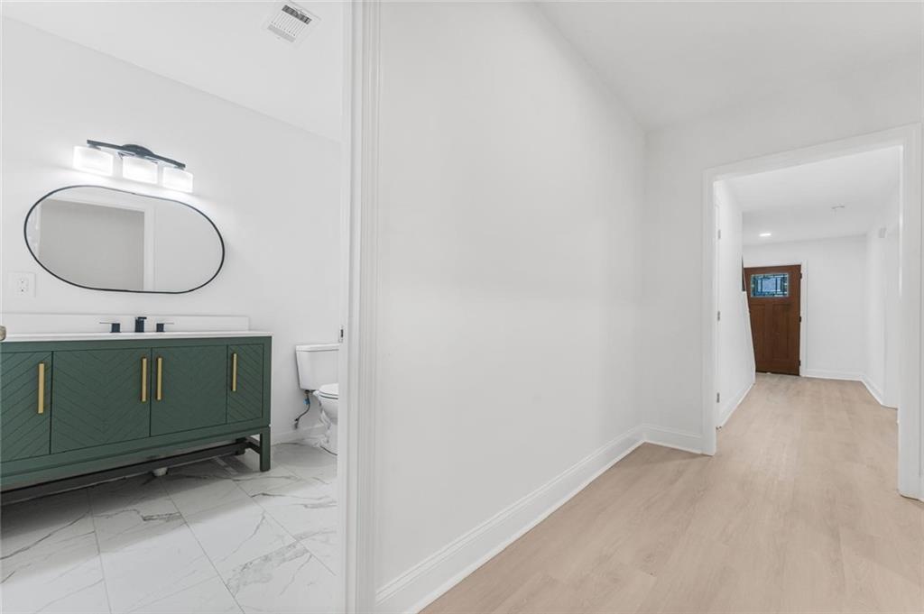 331 Highway 162 Covington, GA 30016 - Photo 15 of 26 a bathroom with a sink and a mirror